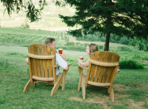 Loudoun County Brewery Dirt Farm Brewing Couple Enjoying View of Loudoun Valley in Adirondack Chairs during Happy Hour