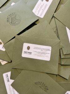 Green envelopes stuffed with prizes for dirt farm brewing's green envelope extravaganza in loudoun county virginia