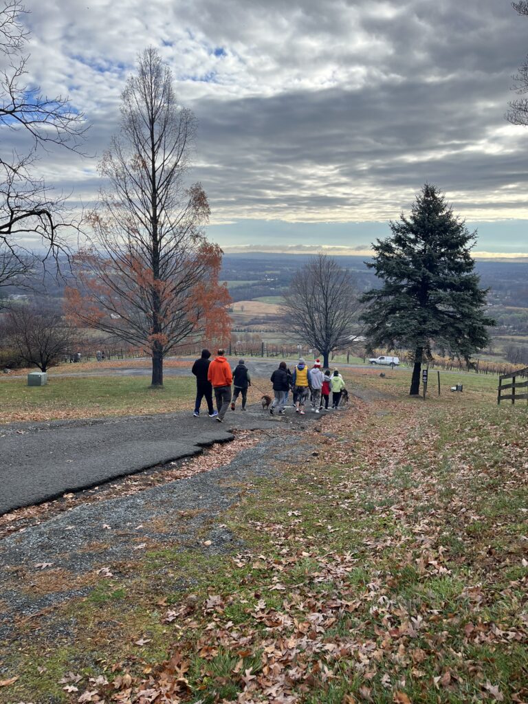 The Jan Plan Hill Climb participants walking down Dirt Farm Brewings driveway in loudoun county virginia