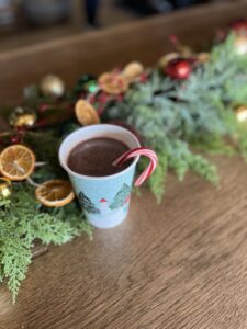 Spiked hot cocoa served with a candy cane at dirt farm brewing in Loudoun county