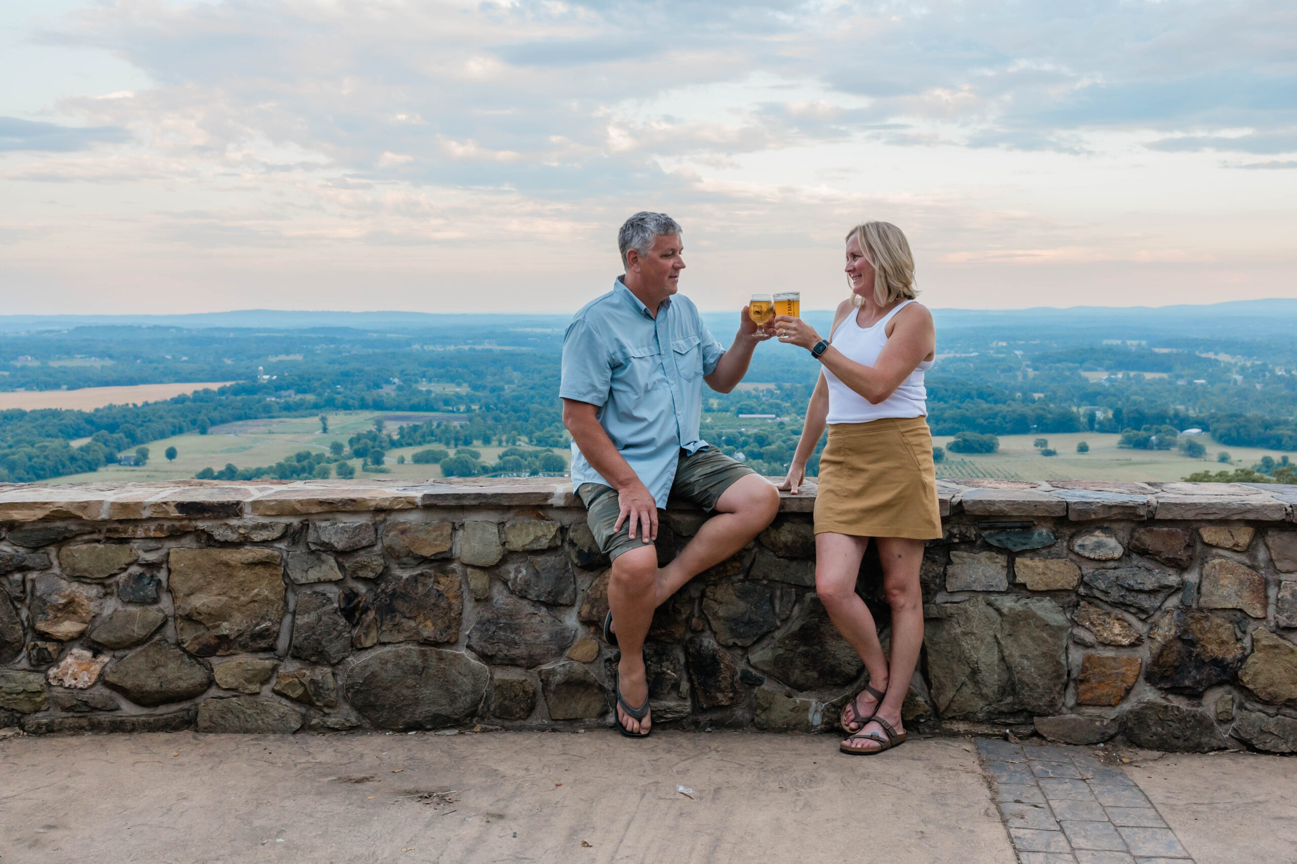 Dirt Farm Brewing Owners Bruce and Janell Zurschmeide cheers a beer after their Founders Tour and Tasting in Loudoun county