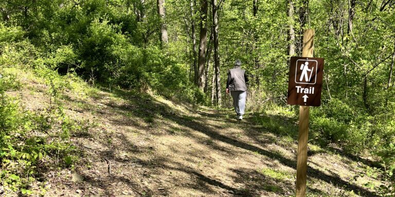 Guests walking on the trails at dirt Farm Brewing during their hiking meet-up