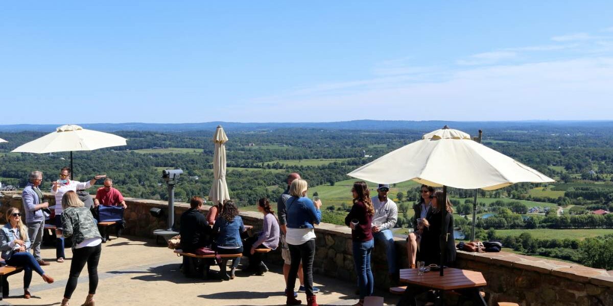 Beer travelers enjoy the view at Dirt Farm (Photo: Michael C. Upton for TravelMag.com)